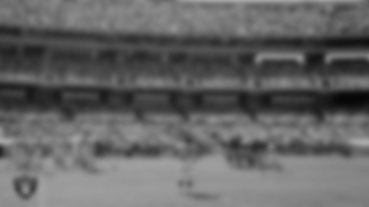 The Raiders huddle during the regular season home game against the Denver Broncos at the Oakland–Alameda County Coliseum, Sunday, September 10, 1967.
