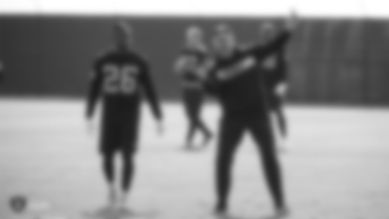 Raiders cornerback Nevin Lawson (26) and senior defensive assistant coach Jim O'Neil at a workout during phase two of the offseason program at the Raiders Practice Facility, in Alameda, Calif.