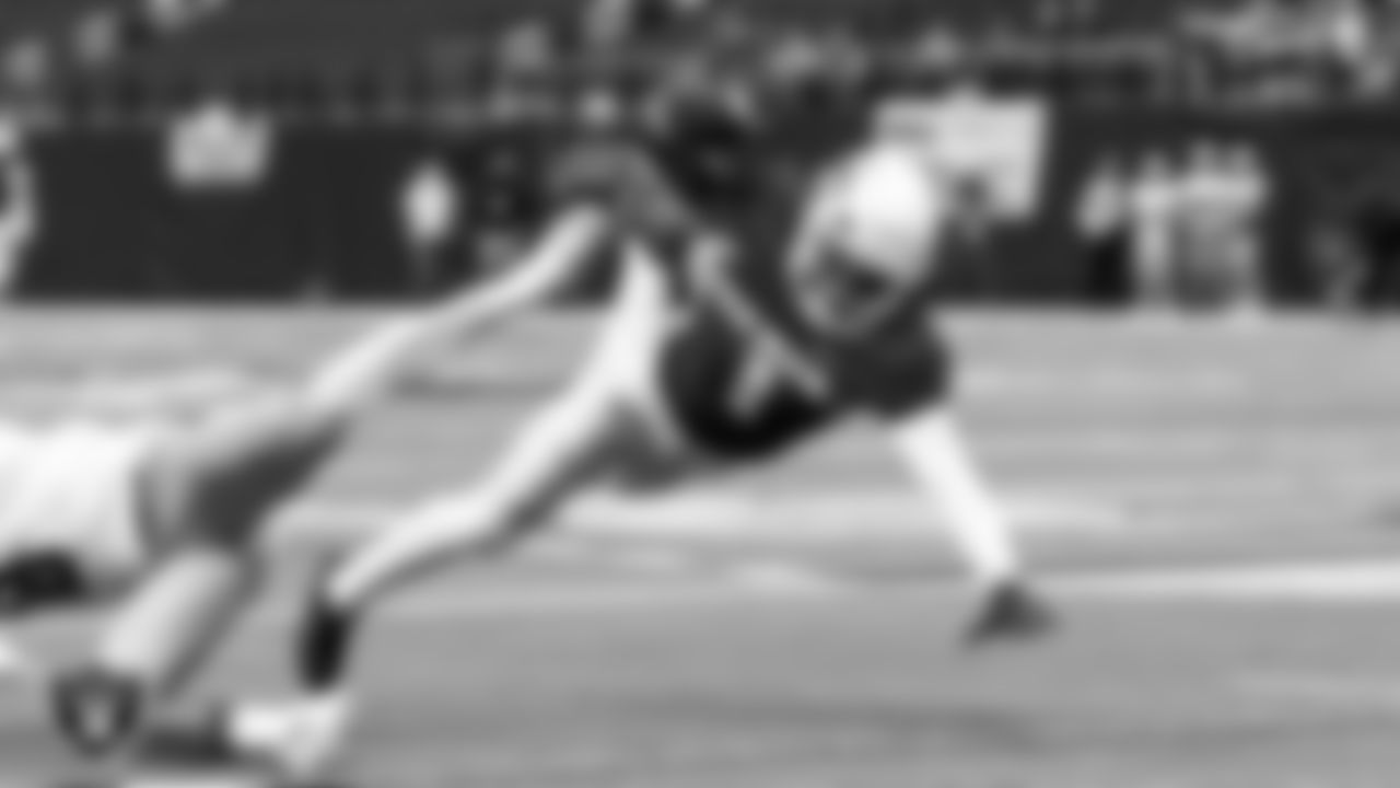 A player from Bishop Gorman High School dives for yardage during a game against Robert McQueen High School at the NIAA Class 5A State Football Championship at Allegiant Stadium.