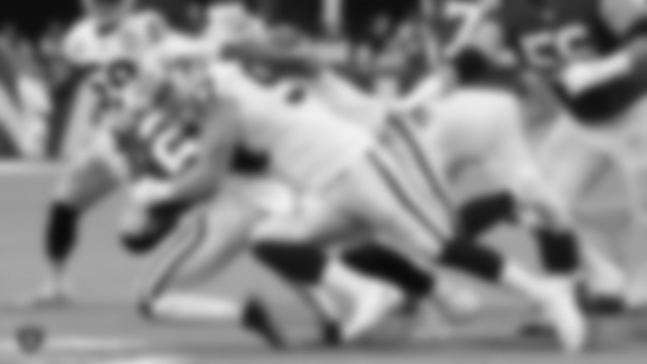 Raiders defensive end Josh Mauro (97) makes a tackle during the Raiders regular season game against the Indianapolis Colts.