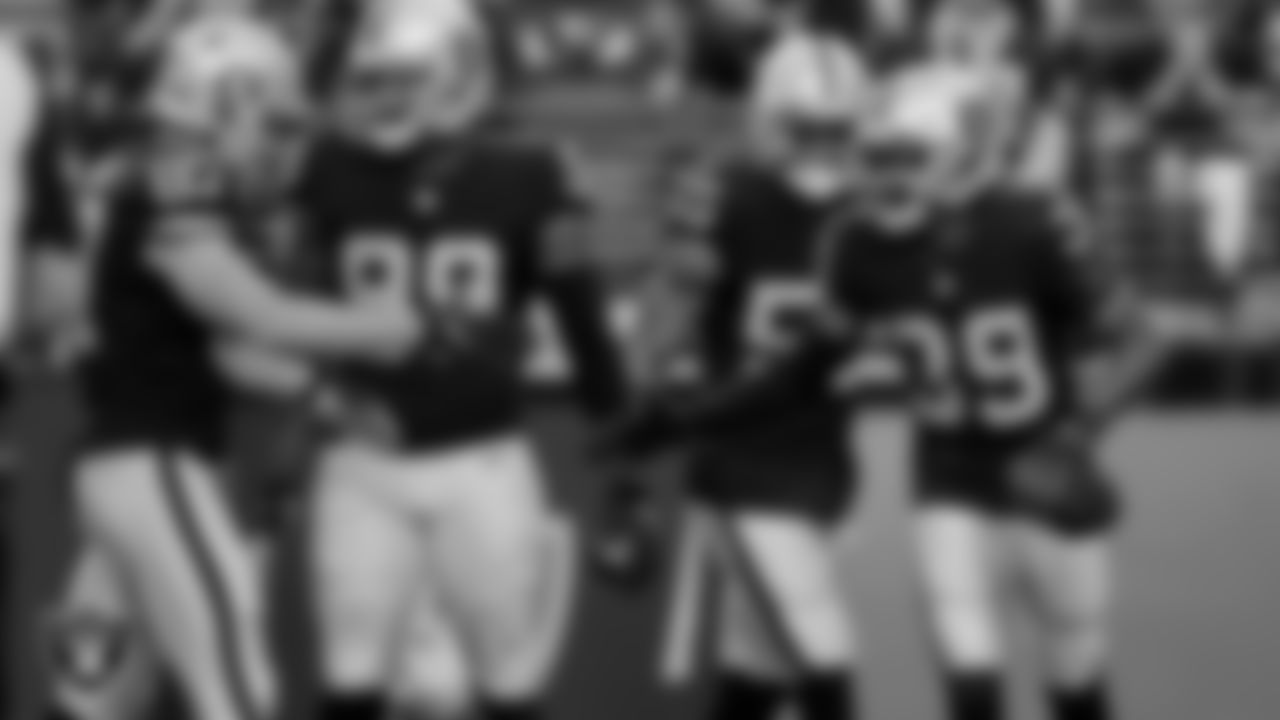 Las Vegas Raiders tight end Foster Moreau (87) and cornerback Nate Hobbs (39) during the regular season home game against the Denver Broncos.
