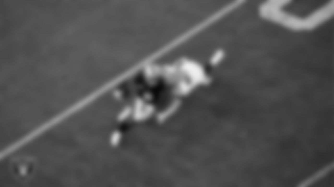 Las Vegas Raiders running back Josh Jacobs (8) rushes during the regular season home game against the Green Bay Packers at Allegiant Stadium.