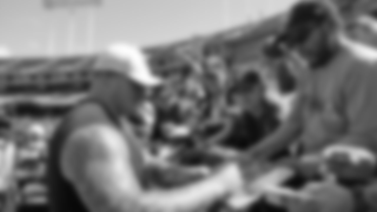Raiders guard Richie Incognito (64) signs autographs for fans before the Raiders preseason game against the Los Angeles Rams.