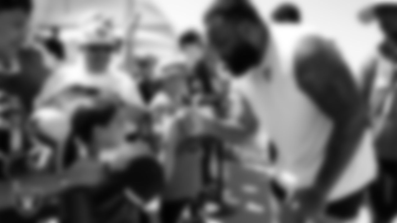 Las Vegas Raiders defensive tackle Nesta Jade Silvera (97) with fans after practice at 2023 Training Camp at Intermountain Health Performance Center.