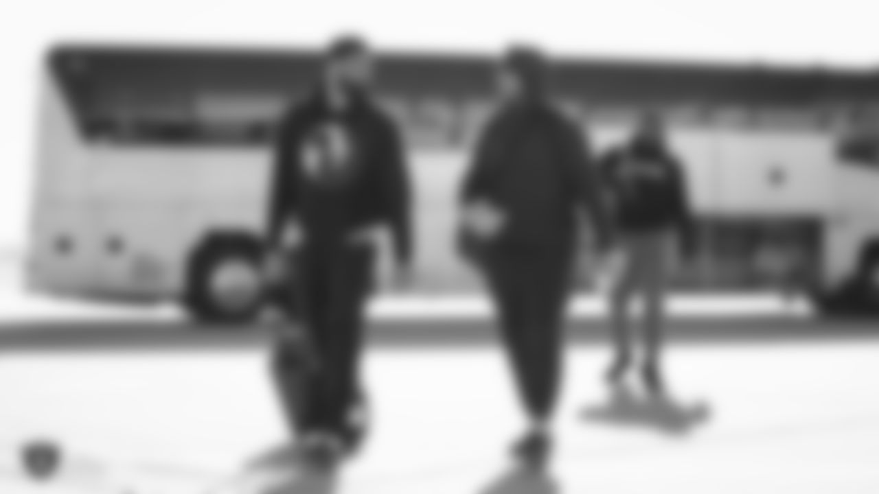 Raiders defensive end Jeremiah Valoaga (94) and linebacker Kyle Wilber (58) depart for the game against the Denver Broncos.