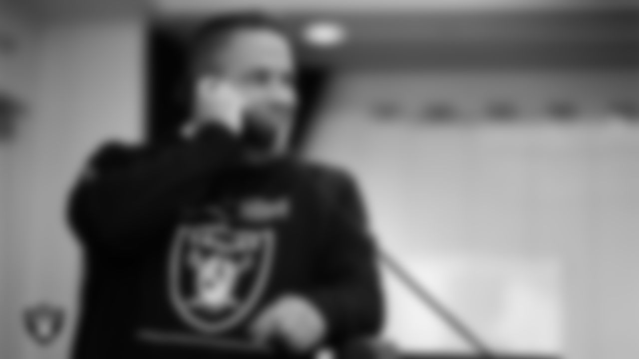 Las Vegas Raiders Head Coach Josh McDaniels on the phone in the draft war room on day 3 of the 2023 NFL Draft at the Las Vegas Raiders Headquarters.