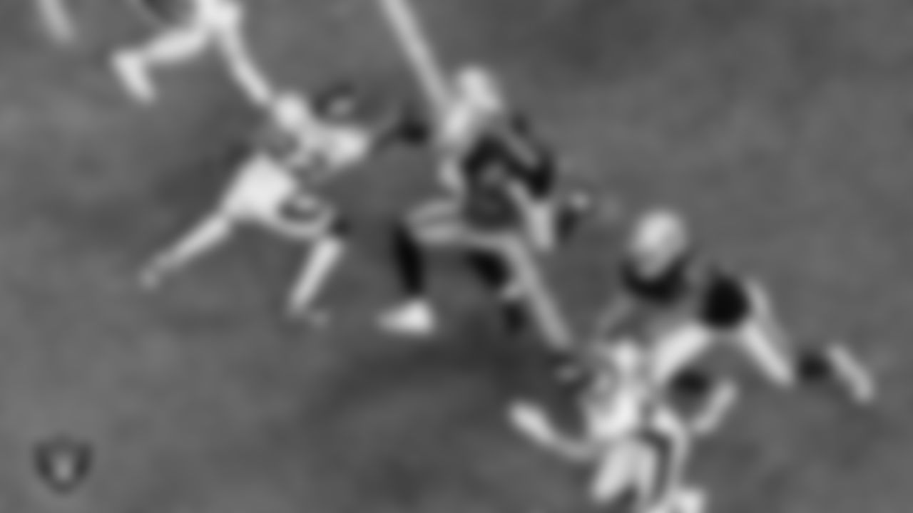 Las Vegas Raiders running back Josh Jacobs (28) rushes as wide receiver Henry Ruggs III (11) and tight end Darren Waller (83) block during the regular season home game against the Denver Broncos.