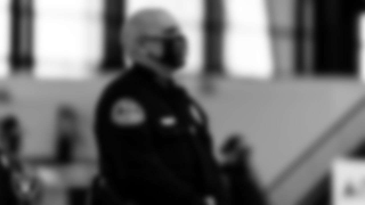 A member of the Henderson Police Department waits to light the Al Davis Memorial Torch before the Las Vegas Raiders regular season home game against the Indianapolis Colts.