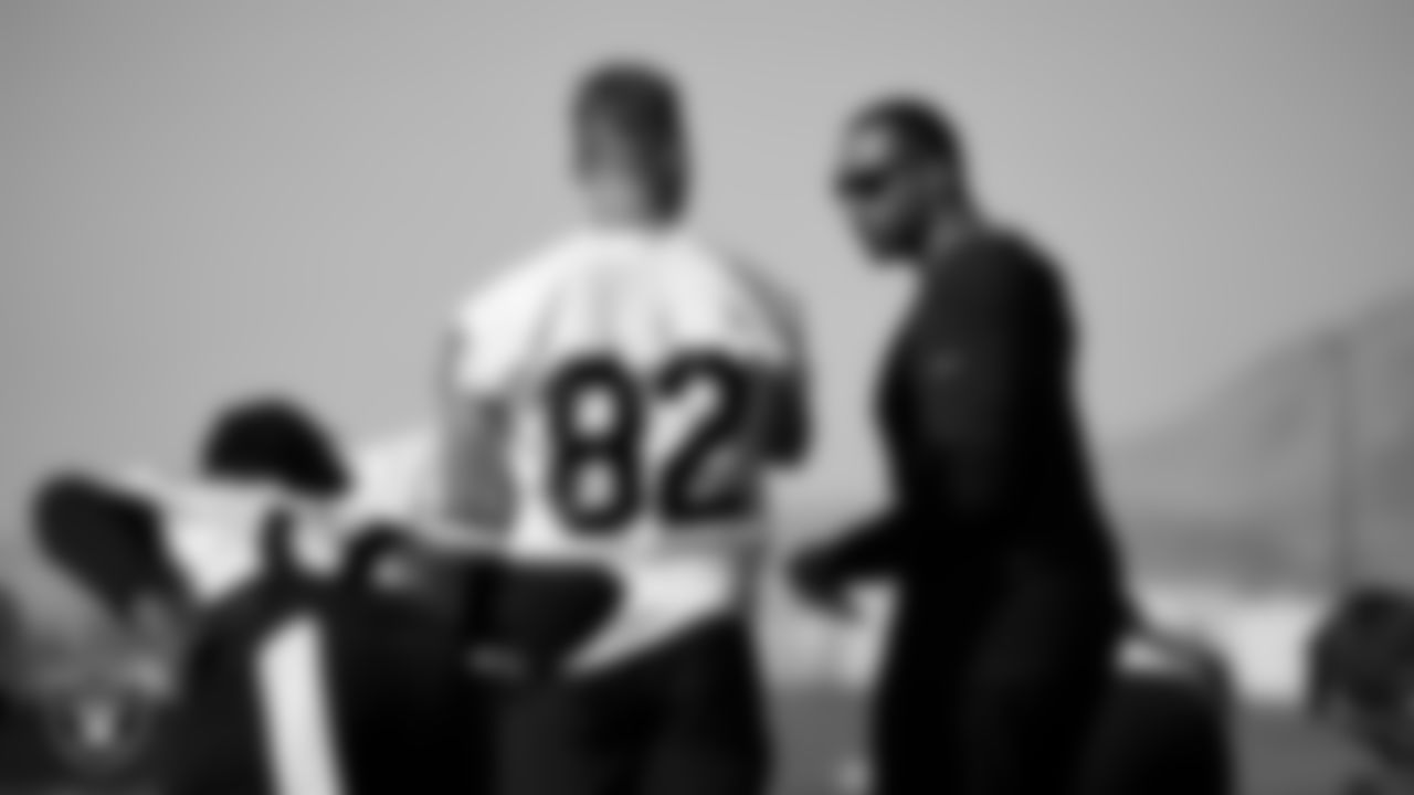 Las Vegas Raiders tight end Nick Bowers (82) and assistant offensive line coach Cameron Clemmons at a workout during phase two of the offseason program.