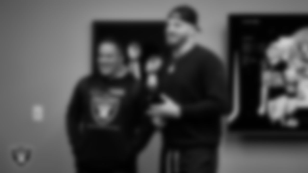 Las Vegas Raiders defensive end Maxx Crosby with Head Coach Josh McDaniels before signing a contract extension.