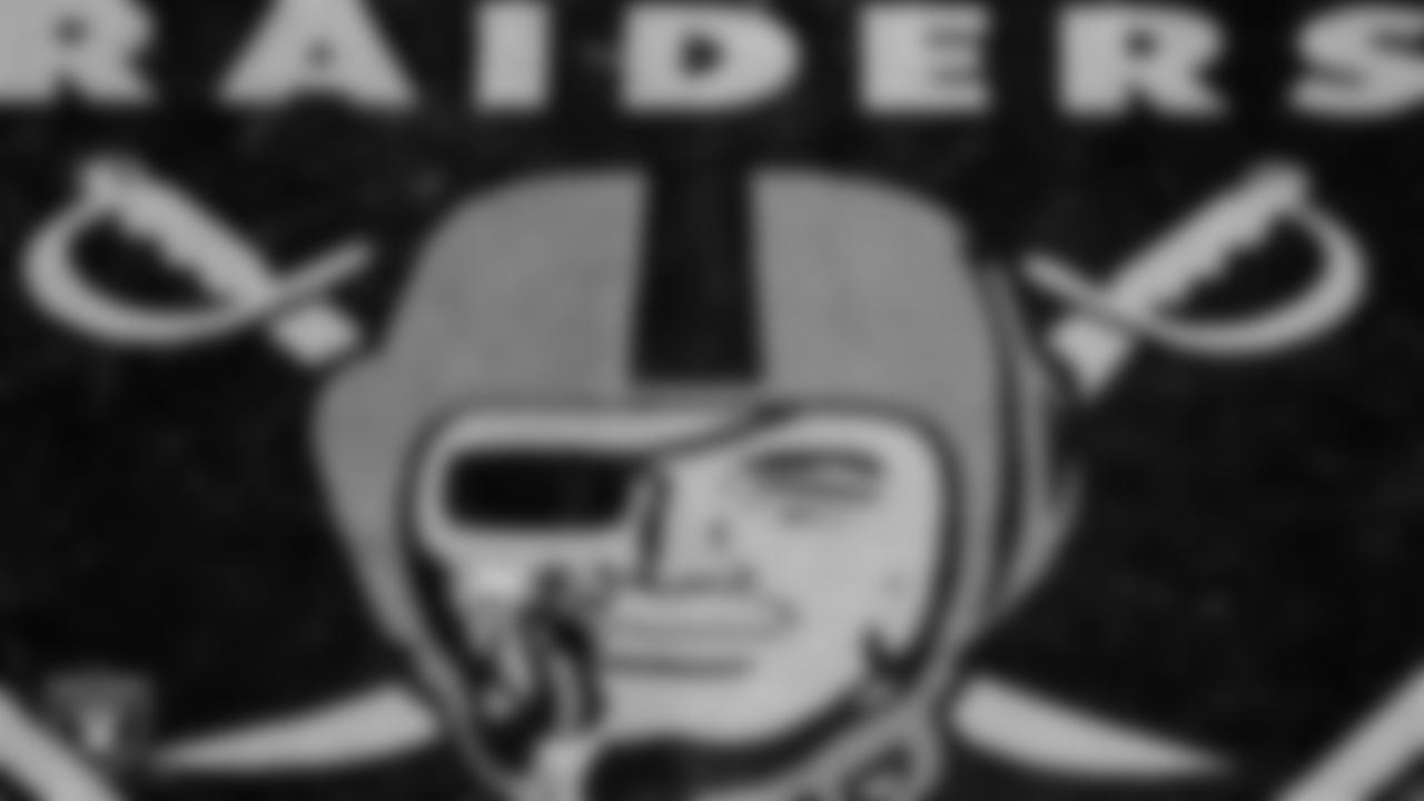 The Raiders warm up before the regular season game against the Denver Broncos at Allegiant Stadium.