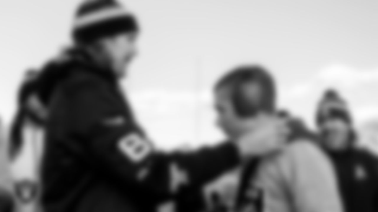 Las Vegas Raiders punter AJ Cole (6) presents a medal to a Liberty High School student after the Unified flag football game.