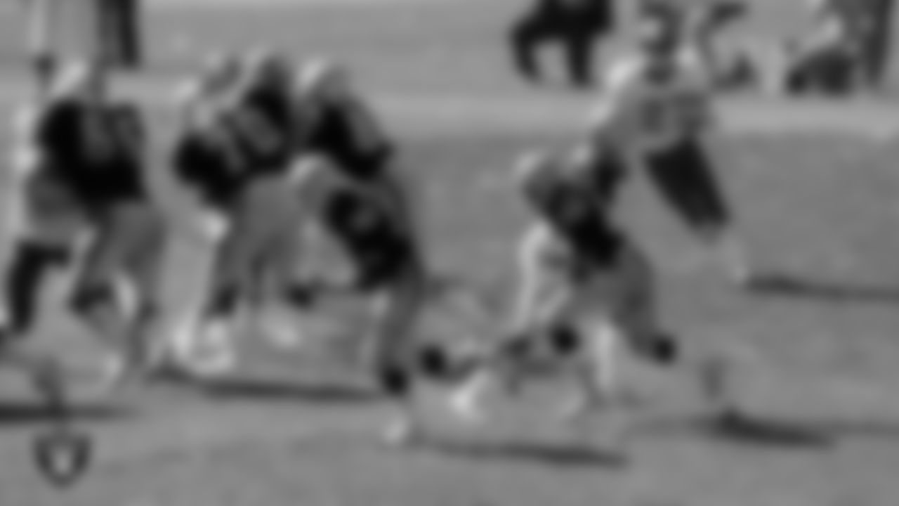 Oakland Raiders quarterback Dan Pastorini (7) hands the ball off to running back Arthur Whittington (22) during the regular season home game against the Washington Football Team at the Oakland–Alameda County Coliseum, Sunday, September 21, 1980, in Oakland, Calif.
