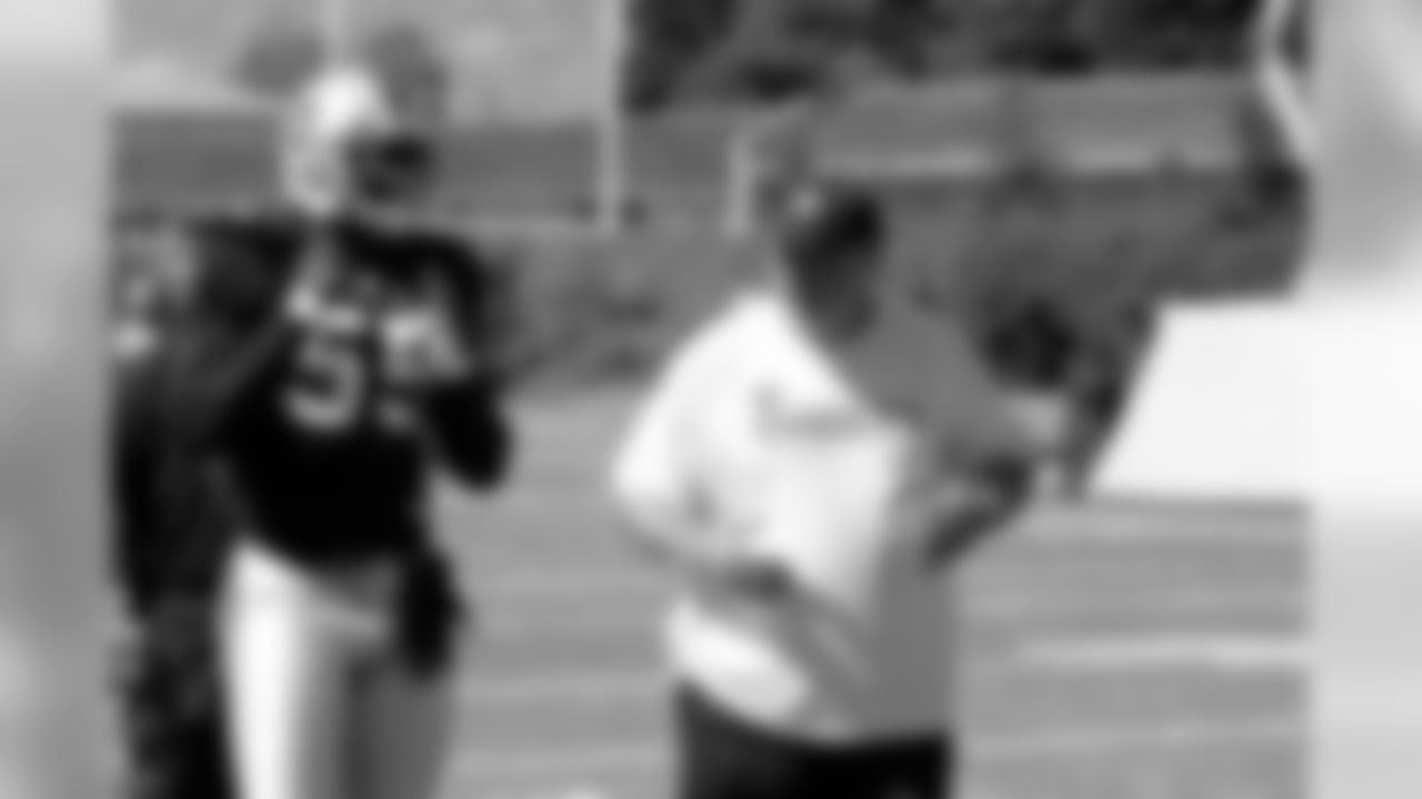 LB Rolando McClain listens to linebackers coach Mike Haluchak.
