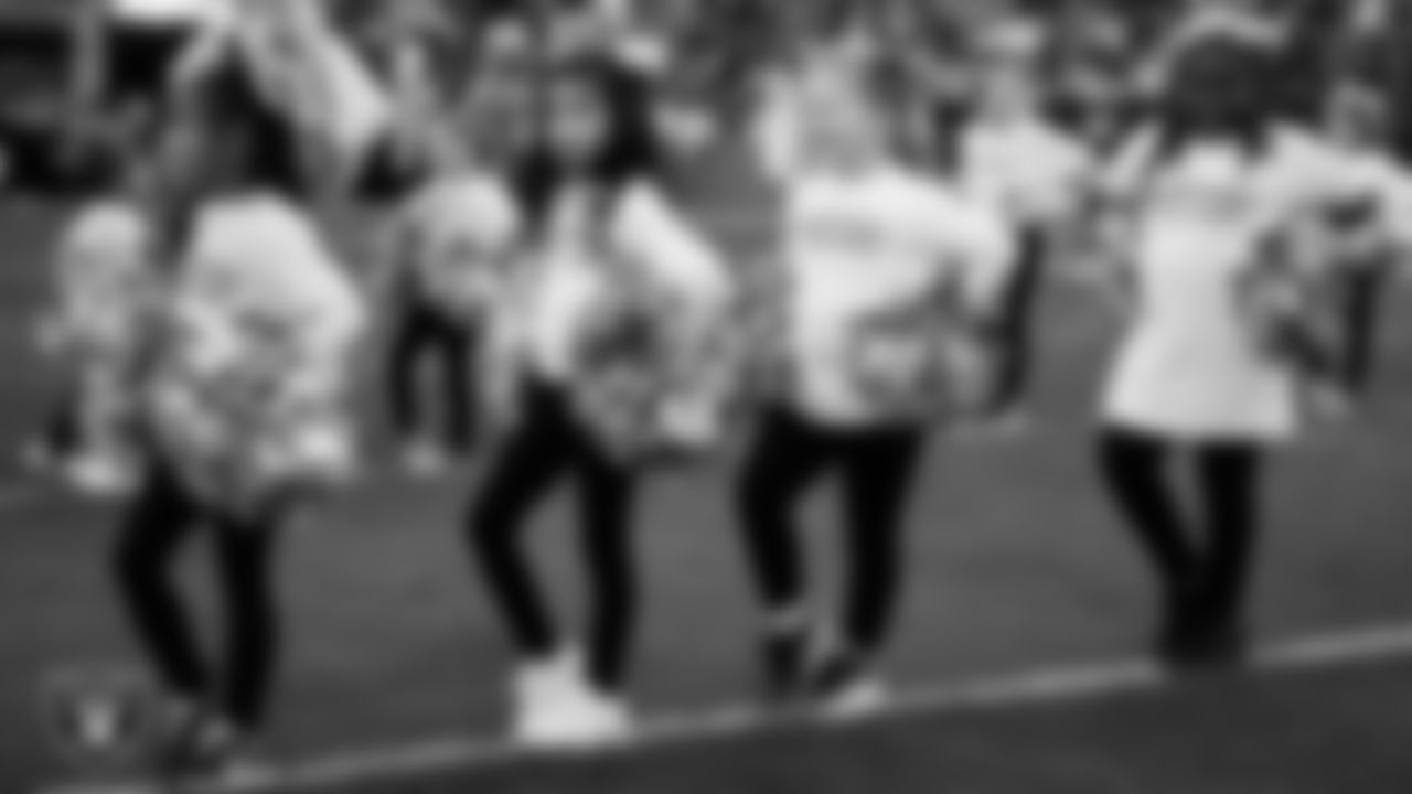 The Raiderettes and Junior Raiderettes perform on the field before the regular season home game against the Los Angeles Chargers at Allegiant Stadium.