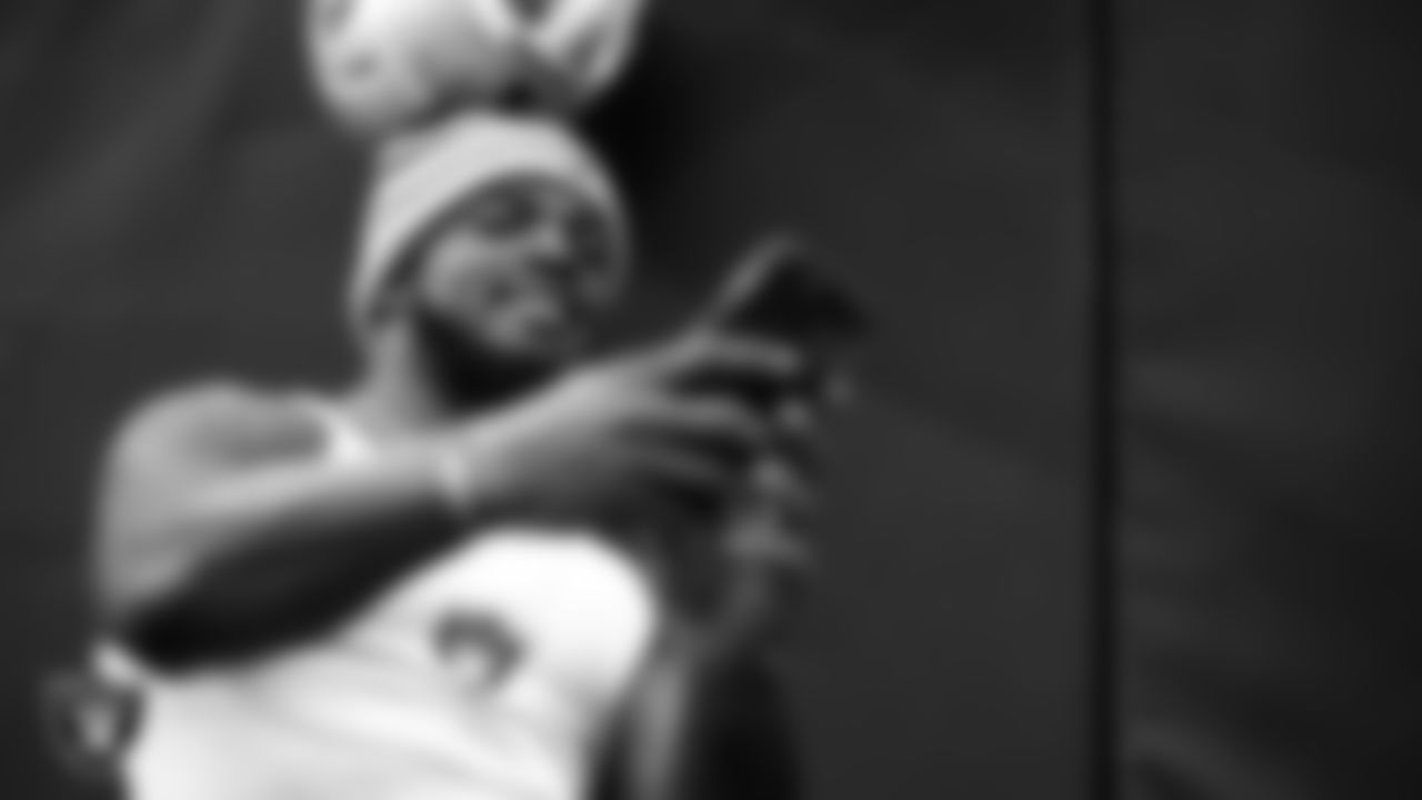 Las Vegas Raiders linebacker Denzel Perryman (52) takes a selfie with fans before the regular season home game against the Indianapolis Colts at Allegiant Stadium.