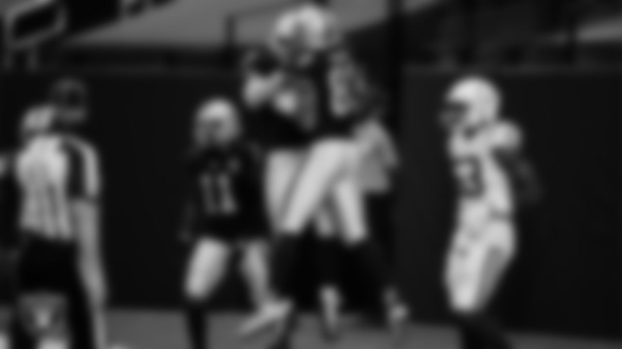 Las Vegas Raiders tight end Foster Moreau (87) celebrates with tight end Darren Waller (83) after making a 47-yard touchdown catch during the regular season home game against the Indianapolis Colts.