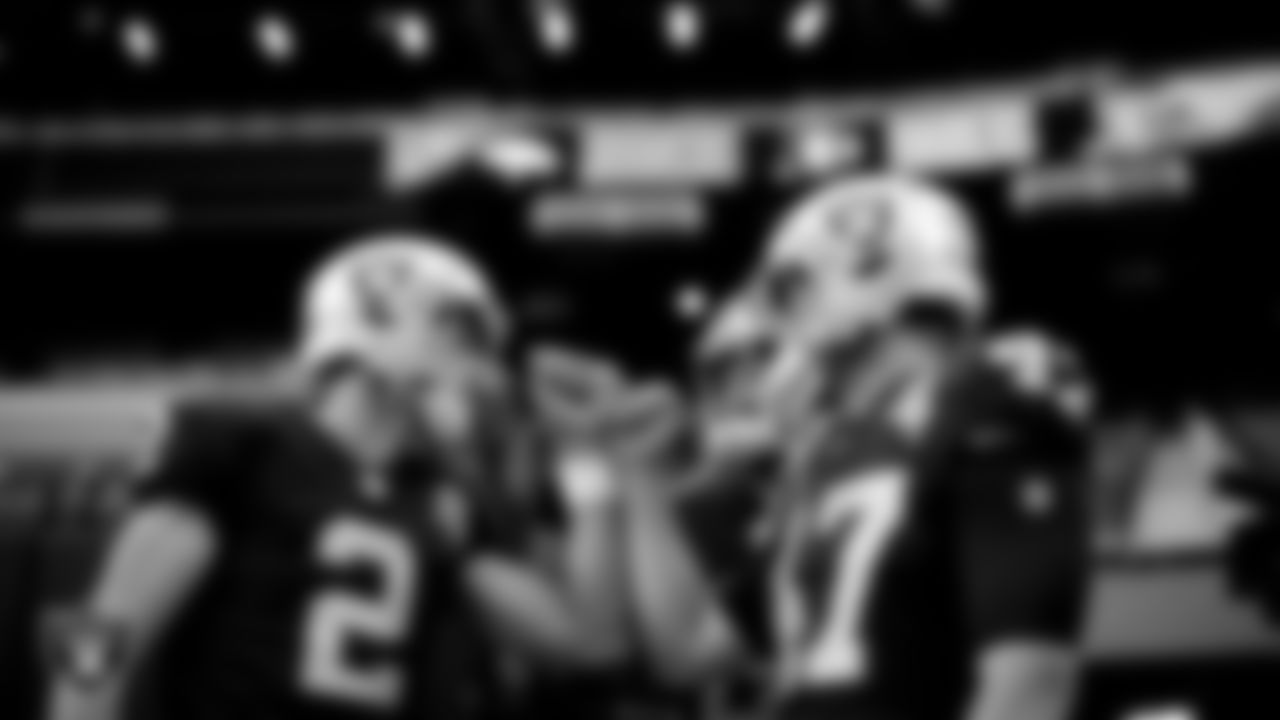 The Raiders special teams players huddle before the regular season game against the Denver Broncos at Allegiant Stadium.