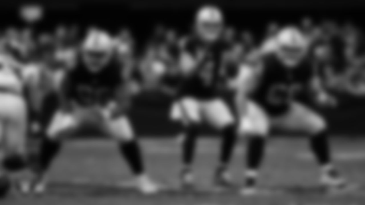 Las Vegas Raiders quarterback Derek Carr (4) receives the snap during the regular season home game against the Denver Broncos at Allegiant Stadium.