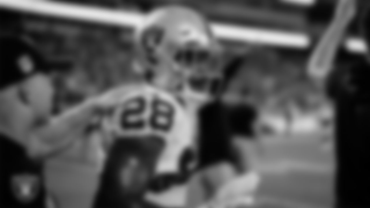 Las Vegas Raiders running back Josh Jacobs (28) warming up before the regular season away game against the Kansas City Chiefs at GEHA Field at Arrowhead Stadium.