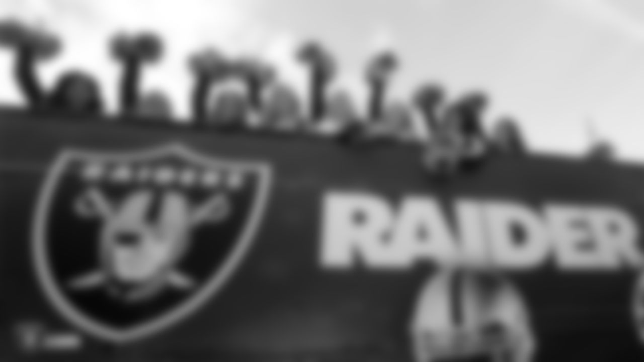 The Raiderettes pose for a photo during the Oakland Raiders Fan Rally at the Admiralty Pub in Trafalgar Square in London on Friday, October 12, 2018.