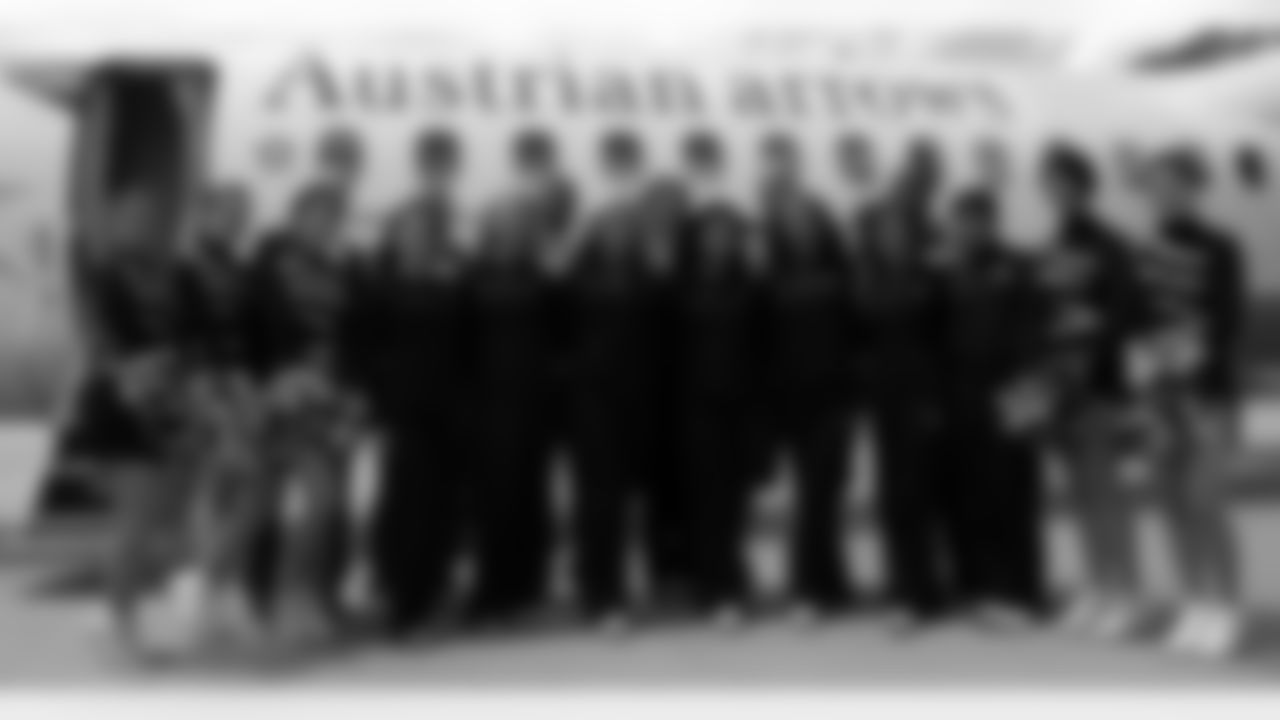 A contigent from the SWARCO Raiders, led by team president Elisabeth Swarovski, poses for a photo with the Oakland Raiders delegation. Photo by Schellhorn.