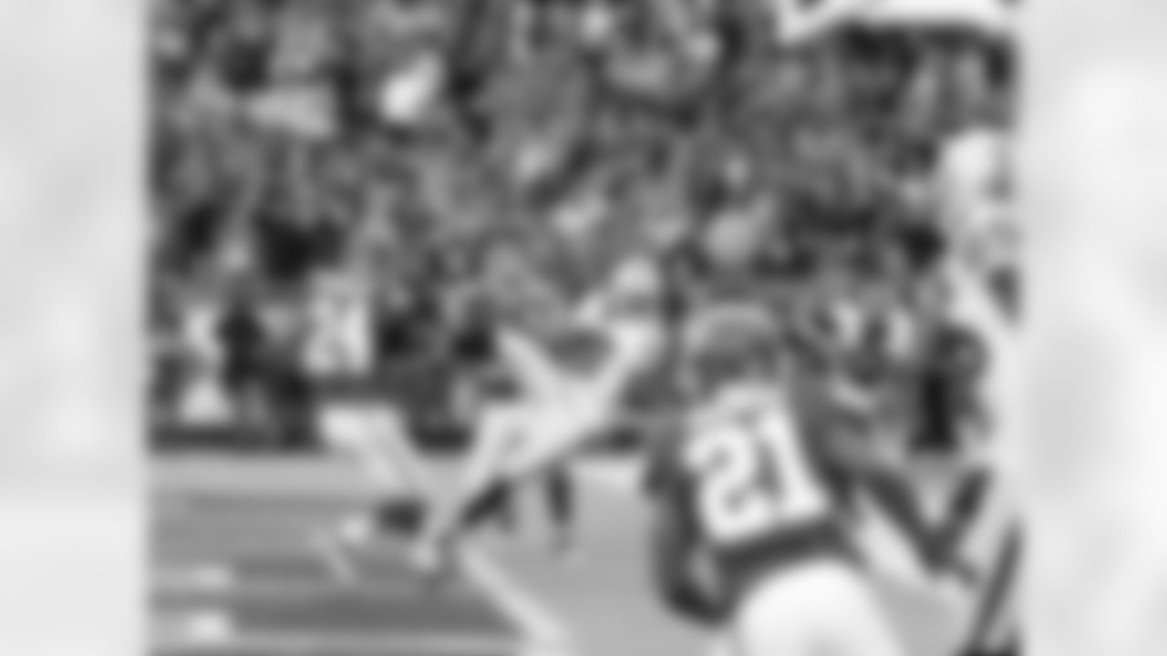 WR Denarius Moore holds on to the ball as he falls to the ground.