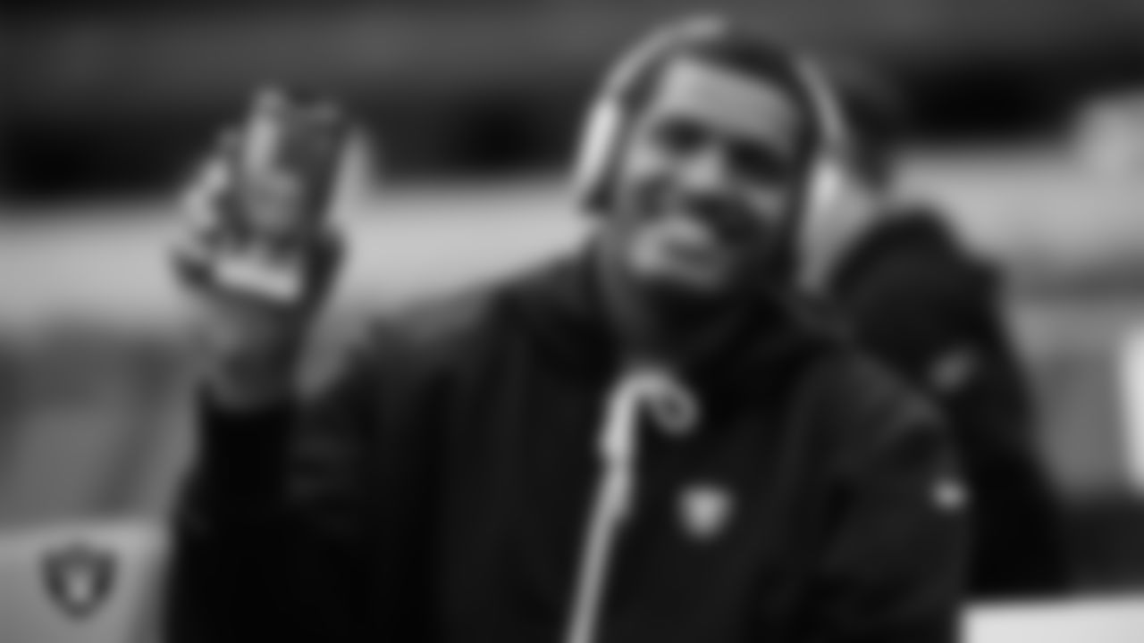 Las Vegas Raiders defensive end Isaac Rochell (96) on the phone with his wife before the preseason away game against the Los Angeles Rams at Sofi Stadium.