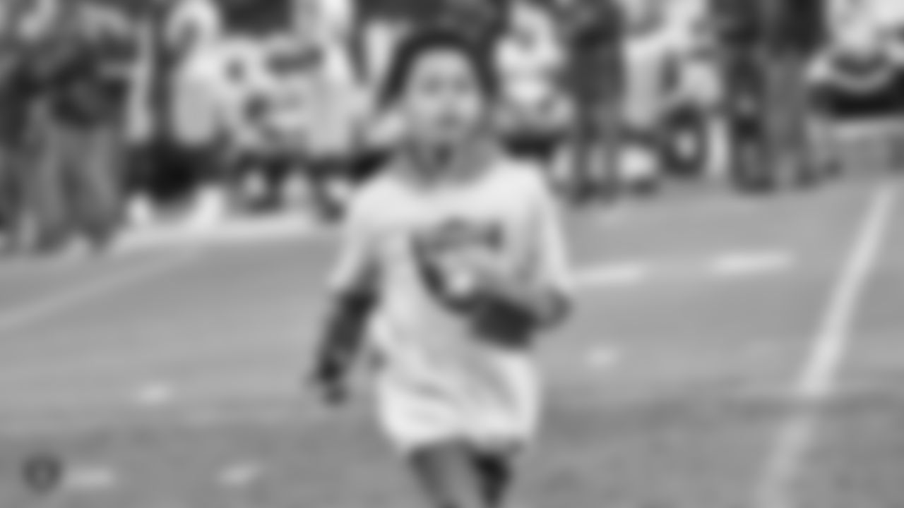 The Kickoff Tee Kid retrieves the kicking tee after kickoff during The Oakland Raiders preseason game against the Green Bay Packers at Oakland-Alameda County Coliseum, Friday, August 24, 2018, in Oakland, California. The Oakland Raiders won 13-6.