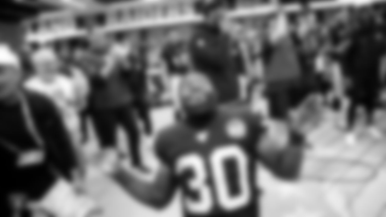 Oakland Raiders running back Jalen Richard (30) celebrates in the locker room after the regular season game against the Chicago Bears at Tottenham Hotspur Stadium.