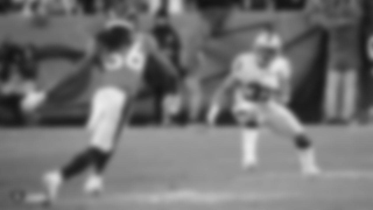 The Raiders during the regular season game against the Denver Broncos at Empower Field at Mile High.