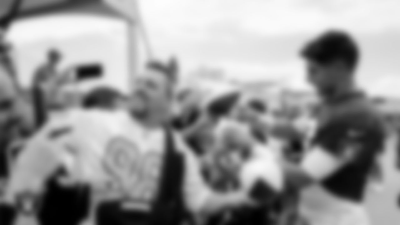 Las Vegas Raiders quarterback Jimmy Garoppolo (10) signs autographs for fans after practice at 2023 Training Camp at Intermountain Health Performance Center.