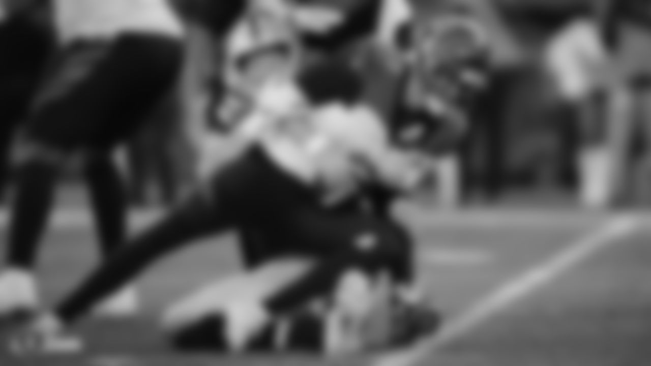 Raiders defensive end Maxx Crosby (98) sacks the quarterback during the regular season game against the Cincinnati Bengals.