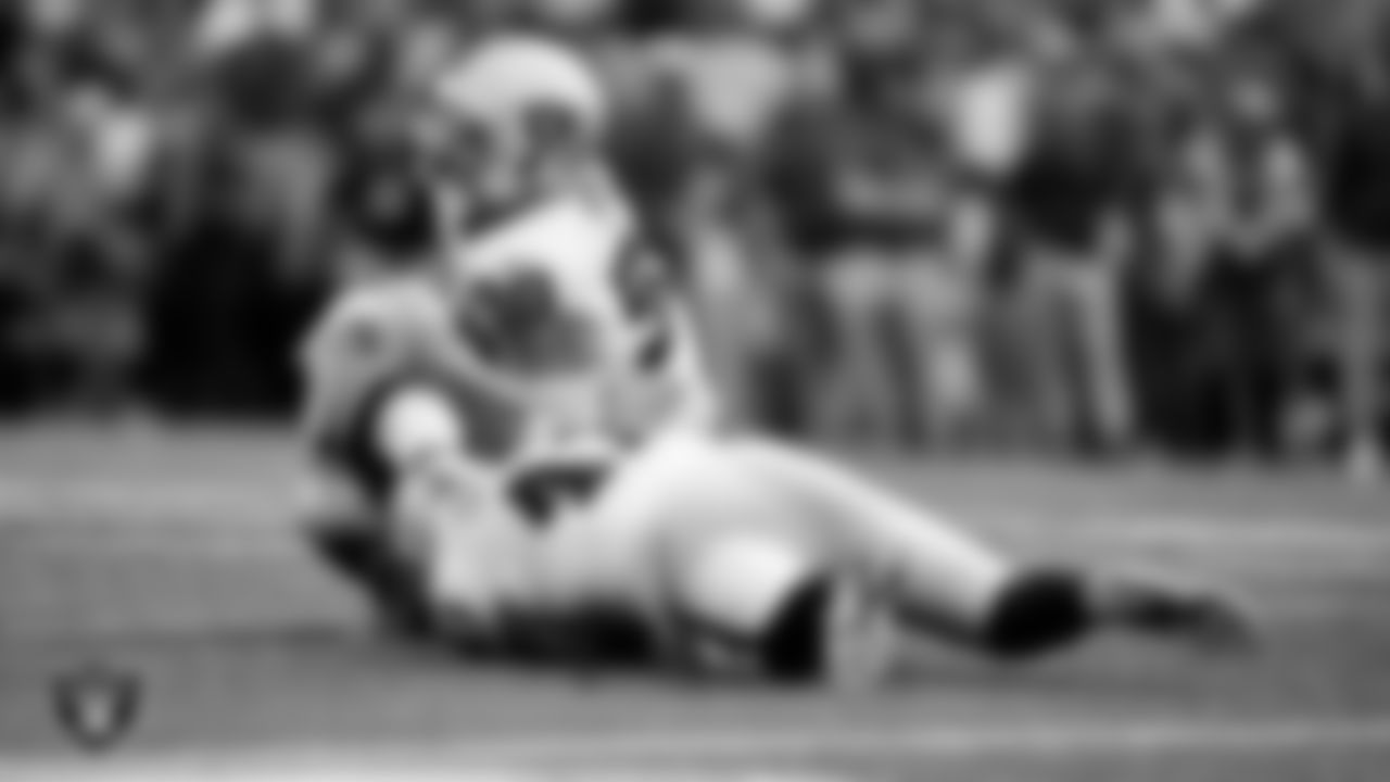 Las Vegas Raiders linebacker Robert Spillane (41) and defensive end Maxx Crosby (98) during the regular season away game against the Buffalo Bills at Highmark Stadium.