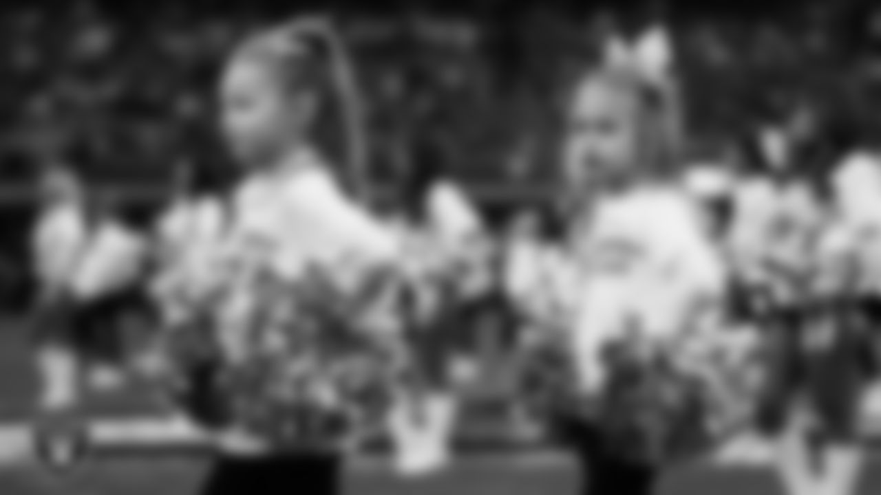 The Raiderettes and Junior Raiderettes perform on the field before the regular season home game against the Los Angeles Chargers at Allegiant Stadium.