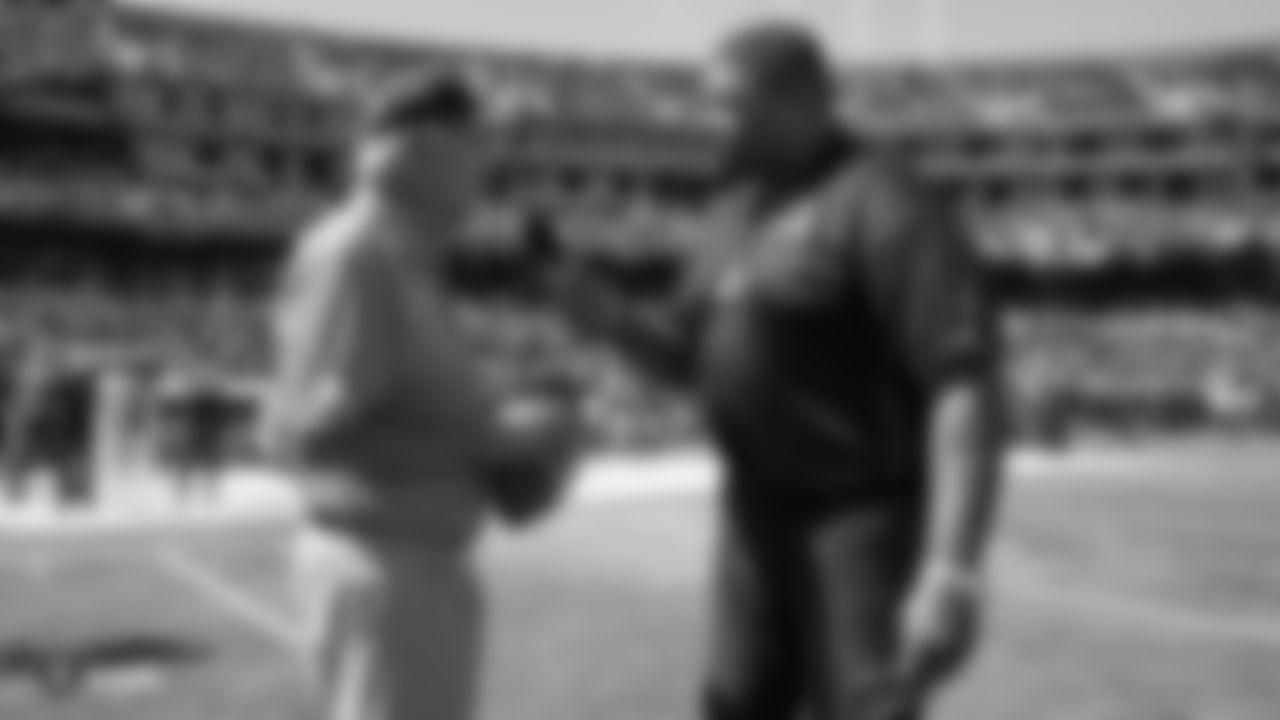 Raiders alumni Daryle Lamonica and Lincoln Kennedy on the field before the Raiders regular season game against the Kansas Chiefs.