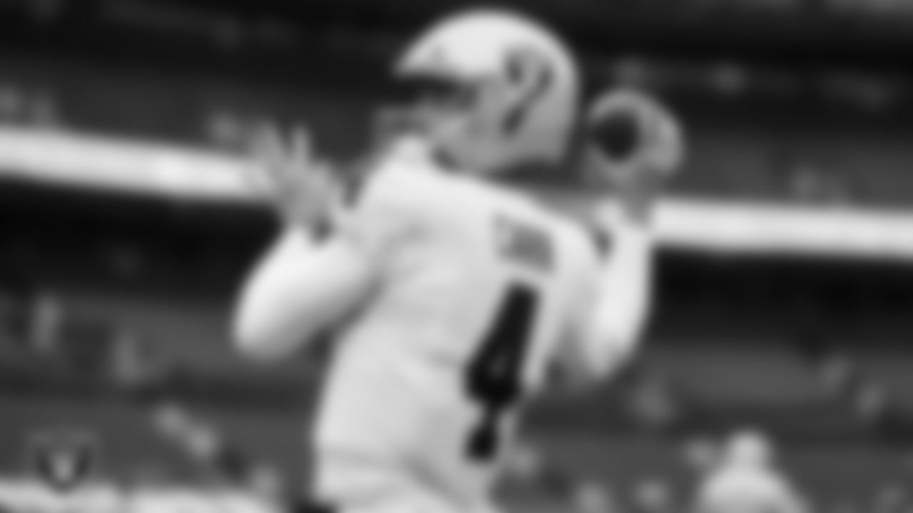 Las Vegas Raiders quarterback Derek Carr (4) warming up before the regular season away game against the Denver Broncos.