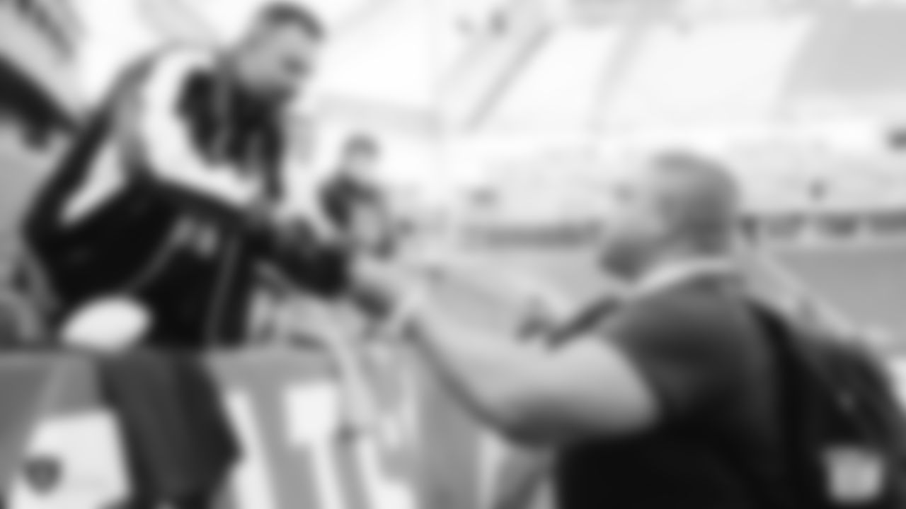 The Raiders interact with fans before the regular season game against the Los Angeles Chargers at ROKiT Field at Dignity Health Sports Park.