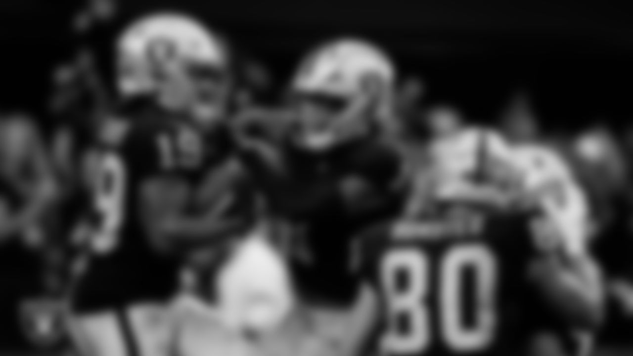 Las Vegas Raiders wide receiver DJ Turner (19) celebrates with wide receiver Tyron Johnson (1) after making a 34-yard touchdown catch during the preseason home game against the Minnesota Vikings at Allegiant Stadium.