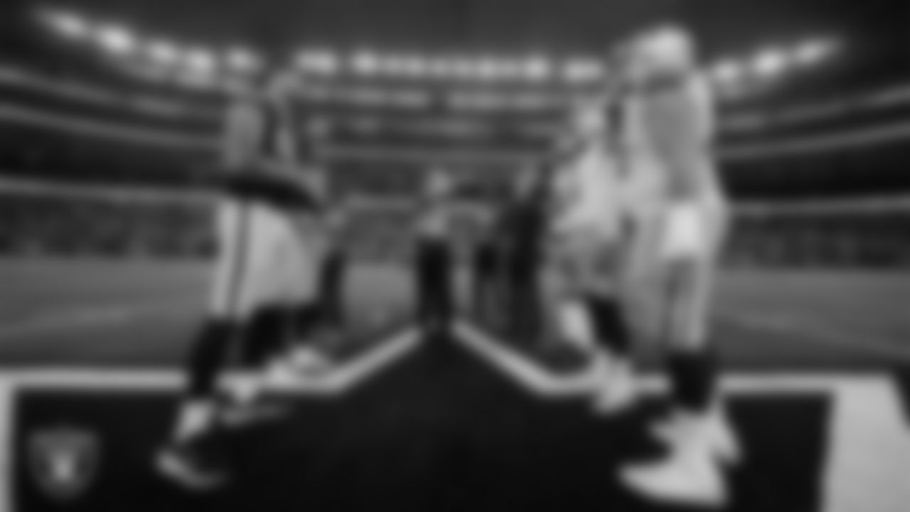 Las Vegas Raiders defensive end Maxx Crosby (98) and punter AJ Cole (6) during the coin toss before the preseason away game against the Dallas Cowboys at AT&T Stadium.