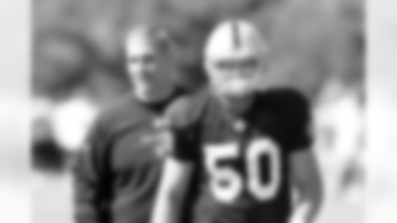 LB Travis Goethel and LB Coach Greg Biekert.