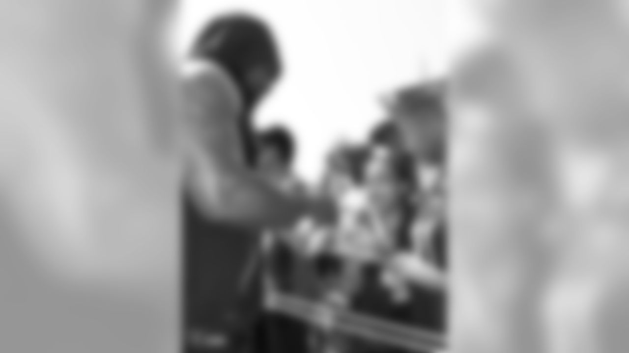 Oakland Raiders running back Marshawn Lynch (24) autographs for fans after practice at 2018 Training Camp at The Oakland Raiders Napa Valley Training Complex, Wednesday, August 1, 2018, in Napa, California.