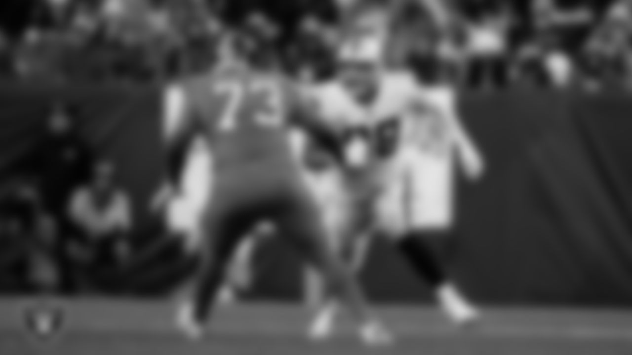 Las Vegas Raiders defensive end Maxx Crosby (98) rushes the quarterback during the regular season away game against the Denver Broncos at Empower Field at Mile High.