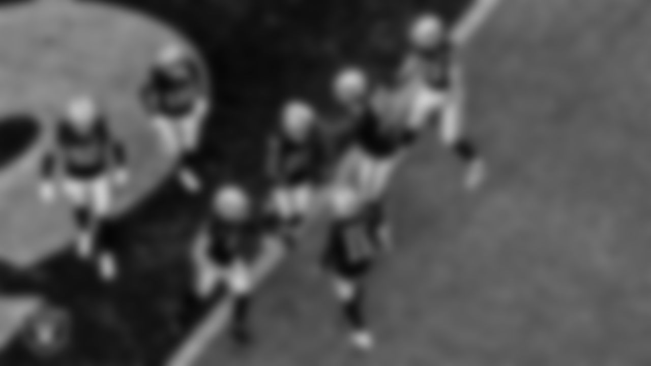 Las Vegas Raiders running back Josh Jacobs (28) celebrates with teammates after rushing for an 11-yard touchdown during the regular season home game against the Denver Broncos.