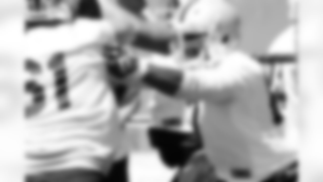 An offensive lineman going through drills.