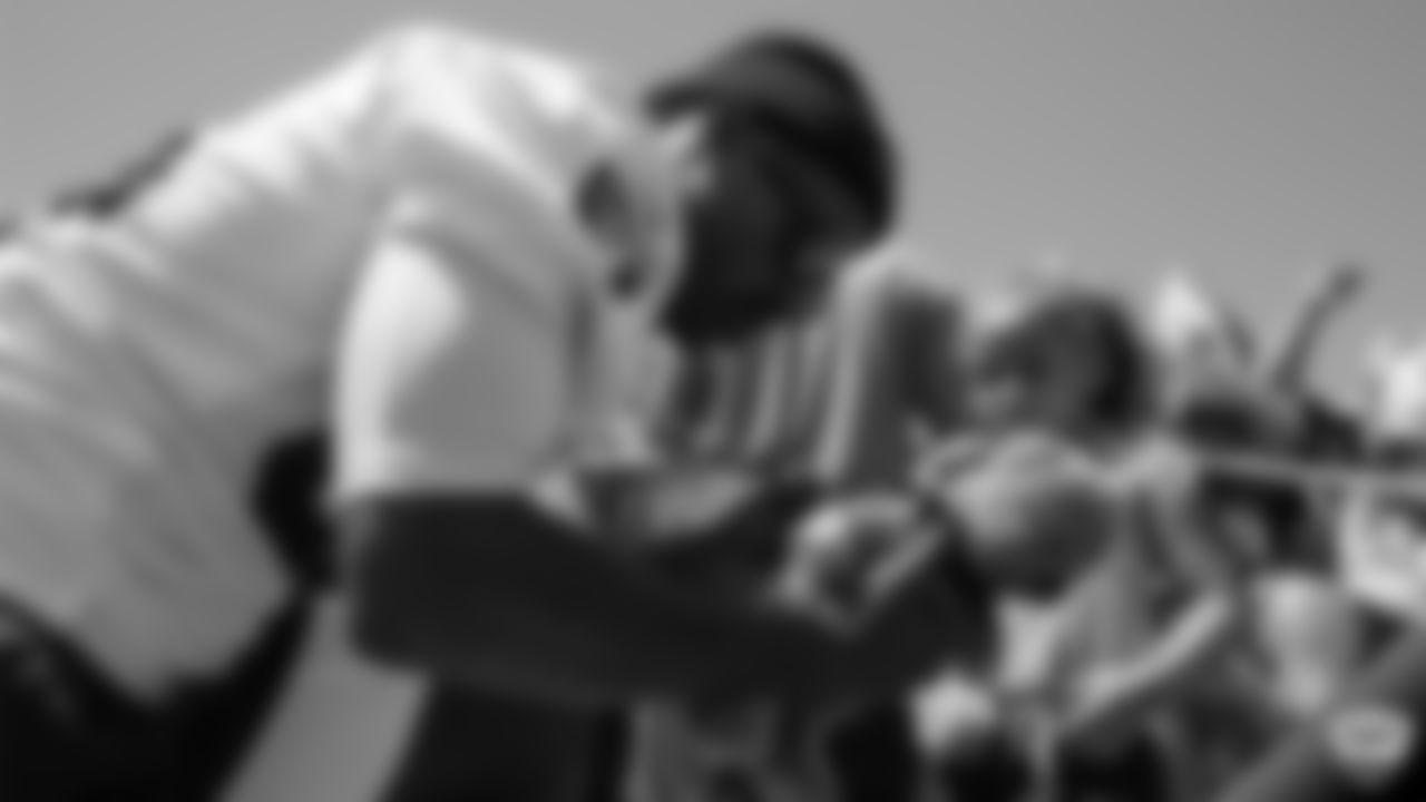 Raiders wide receiver Antonio Brown (84) signs autographs for fans after practice at 2019 Training Camp.