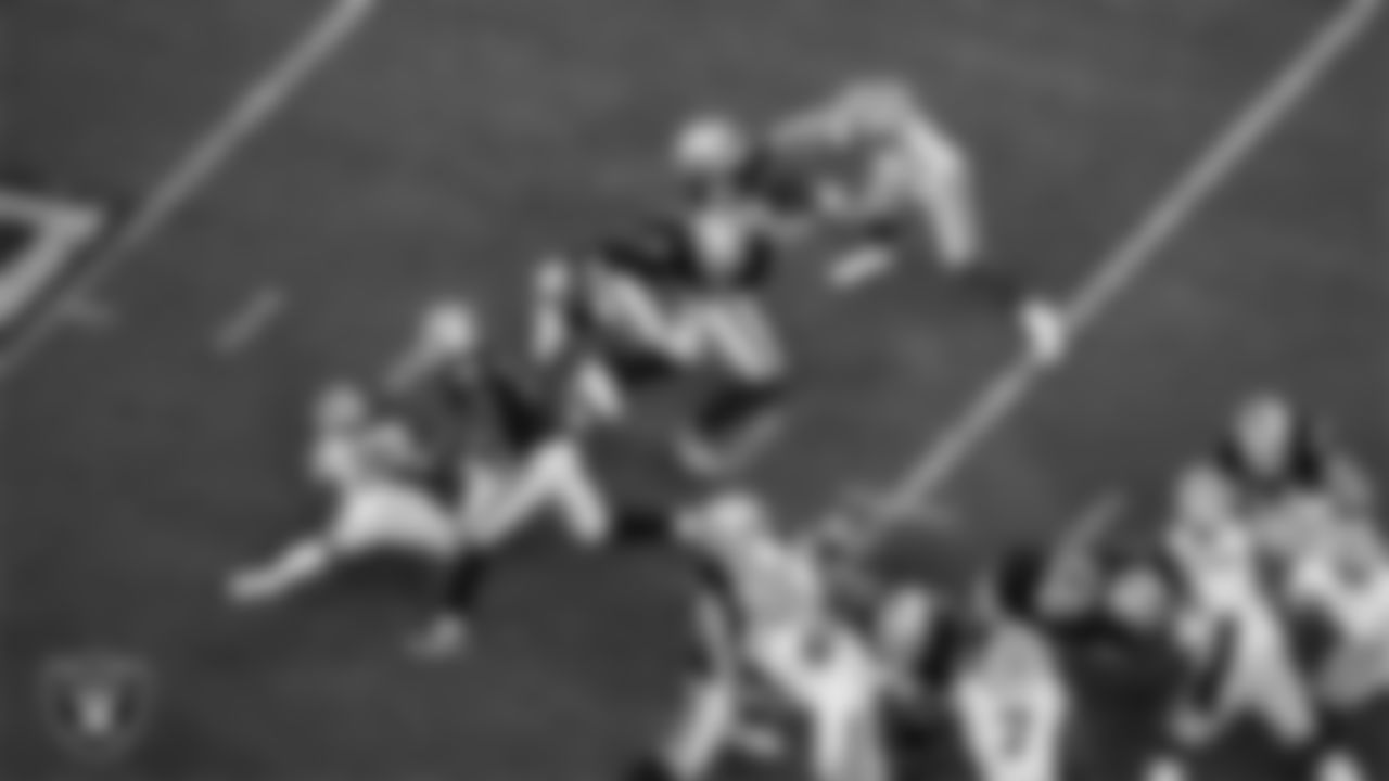Las Vegas Raiders running back Josh Jacobs (8) rushes during the regular season home game against the Green Bay Packers at Allegiant Stadium.