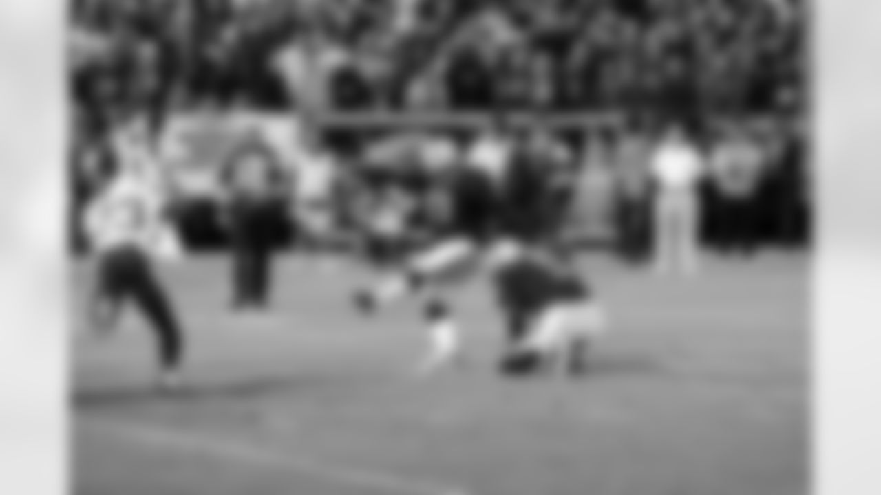 K Sebastian Janikowski kicks the extra point out of the hold of P Shane Lechler.