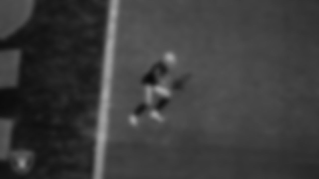 Las Vegas Raiders wide receiver Mack Hollins (10) downs a punt at the 2-yard line during the regular season home game against the New England Patriots at Allegiant Stadium.