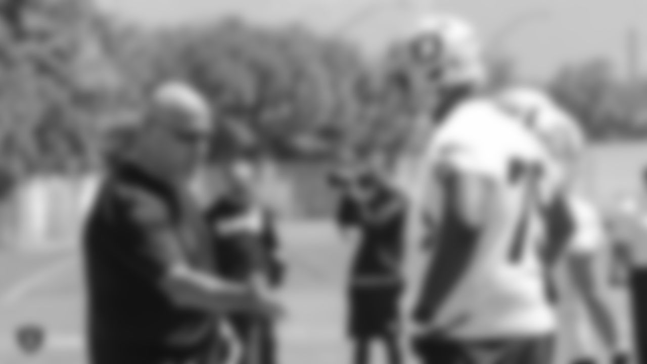 Oakland Raiders offensive line coach Tom Cable and offensive tackle Brandon Parker (75) at an Organized Team Activity (OTA) at the Oakland Raiders Practice Facility, Tuesday, June 5, 2018, in Alameda, California.